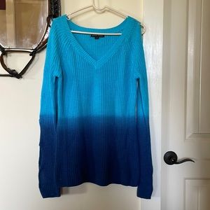 Boston Proper light weight sweater with arm cutouts from shoulder to wrist.